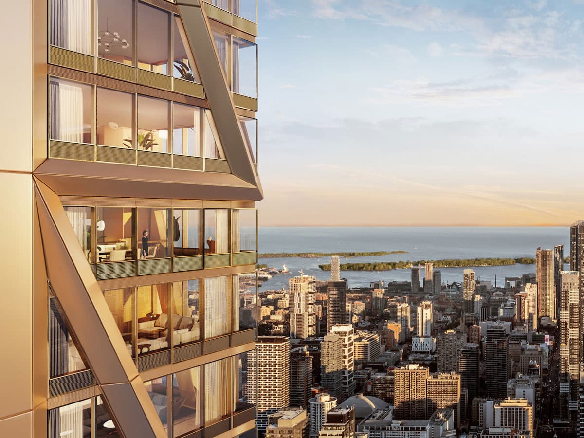 The champagne-bronze exoskeleton of One Bloor West catches golden light above Lake Ontario